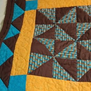 Patchwork Quilt with Brown and Blue Accents